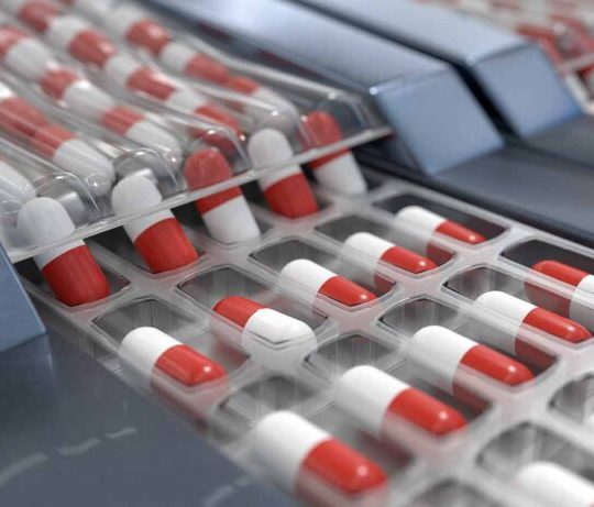 Red and white capsules in pharmaceutical production line. 3D rendered illustration.